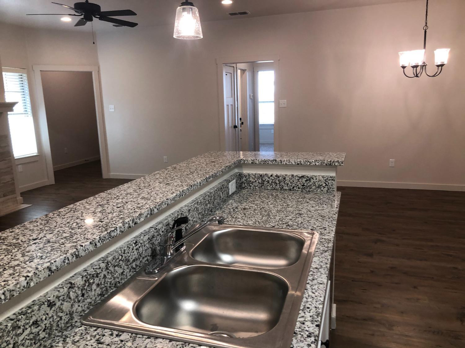 2723 137th Street Lubbock, TX 79423 - Photo 6 of 19 a bathroom with a sink and a mirror