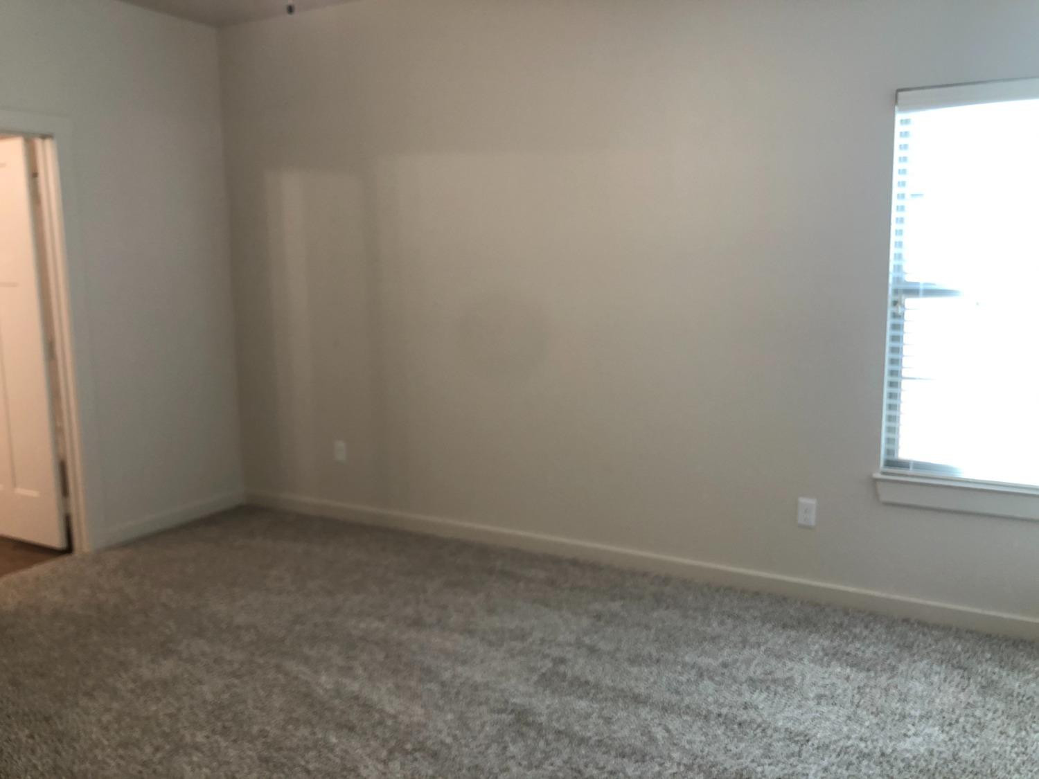 2723 137th Street Lubbock, TX 79423 - Photo 9 of 19 an empty room with a window