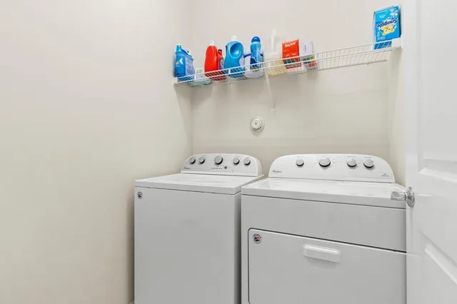 a bedroom with a bed and dresser