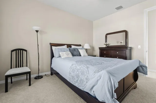 a spacious bathroom with a double vanity sink mirror and double