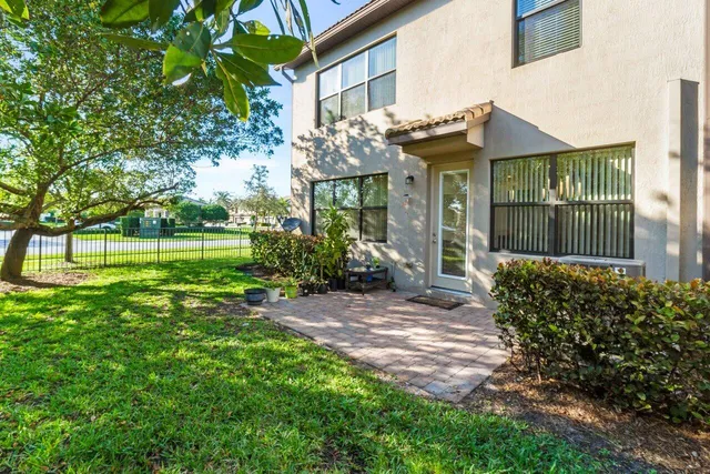 a living room with furniture a table and chairs