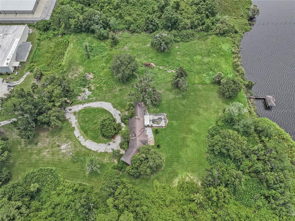 2000 Dundee Road Winter Haven, FL 33884 - Photo 29 of 35 an aerial view of residential house with outdoor space and trees all around