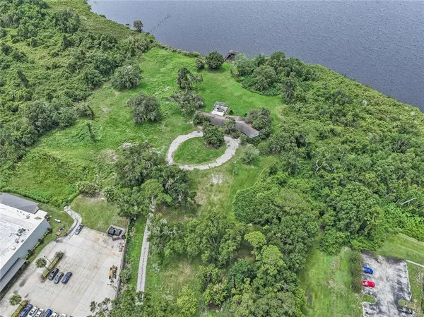 an aerial view of a house with a yard