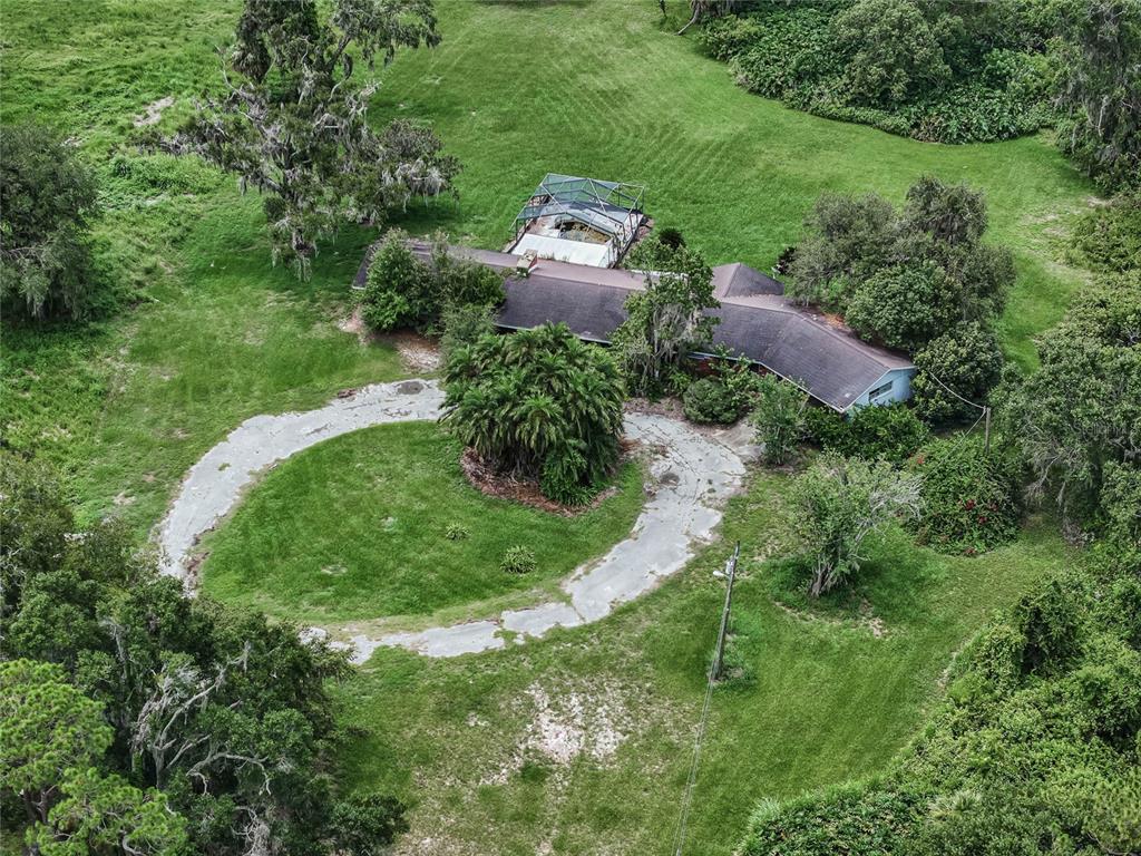 2000 Dundee Road Winter Haven, FL 33884 - Photo 31 of 35 an aerial view of a house with a yard