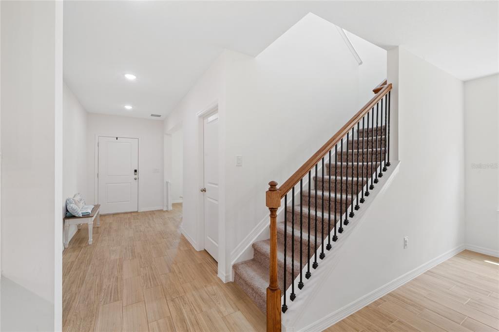 1137 Bradford Rdg Drive Leesburg, FL 34748 - Photo 10 of 37 a view of a hallway with wooden floor and entryway
