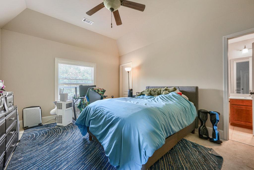 345 Masters Club Boulevard Hampton, GA 30228 - Photo 22 of 30 a bedroom with a bed and window