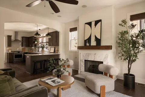 a living room with furniture and a fireplace