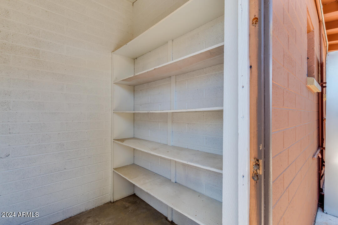 1921 East Virginia Avenue, Unit 14 Phoenix, AZ 85006 - Photo 16 of 20 a view of walk in closet with empty racks