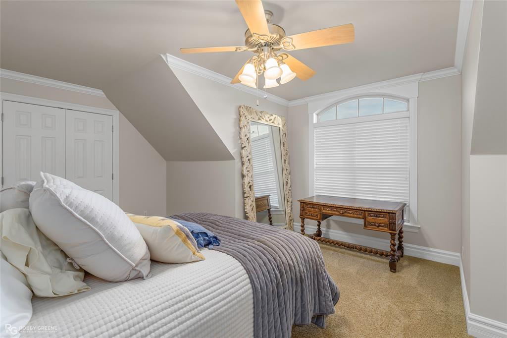 200 Evangeline Walk Bossier City, LA 71111 - Photo 31 of 39 a bedroom with a bed and a chandelier