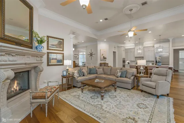 a living room with furniture and a fireplace