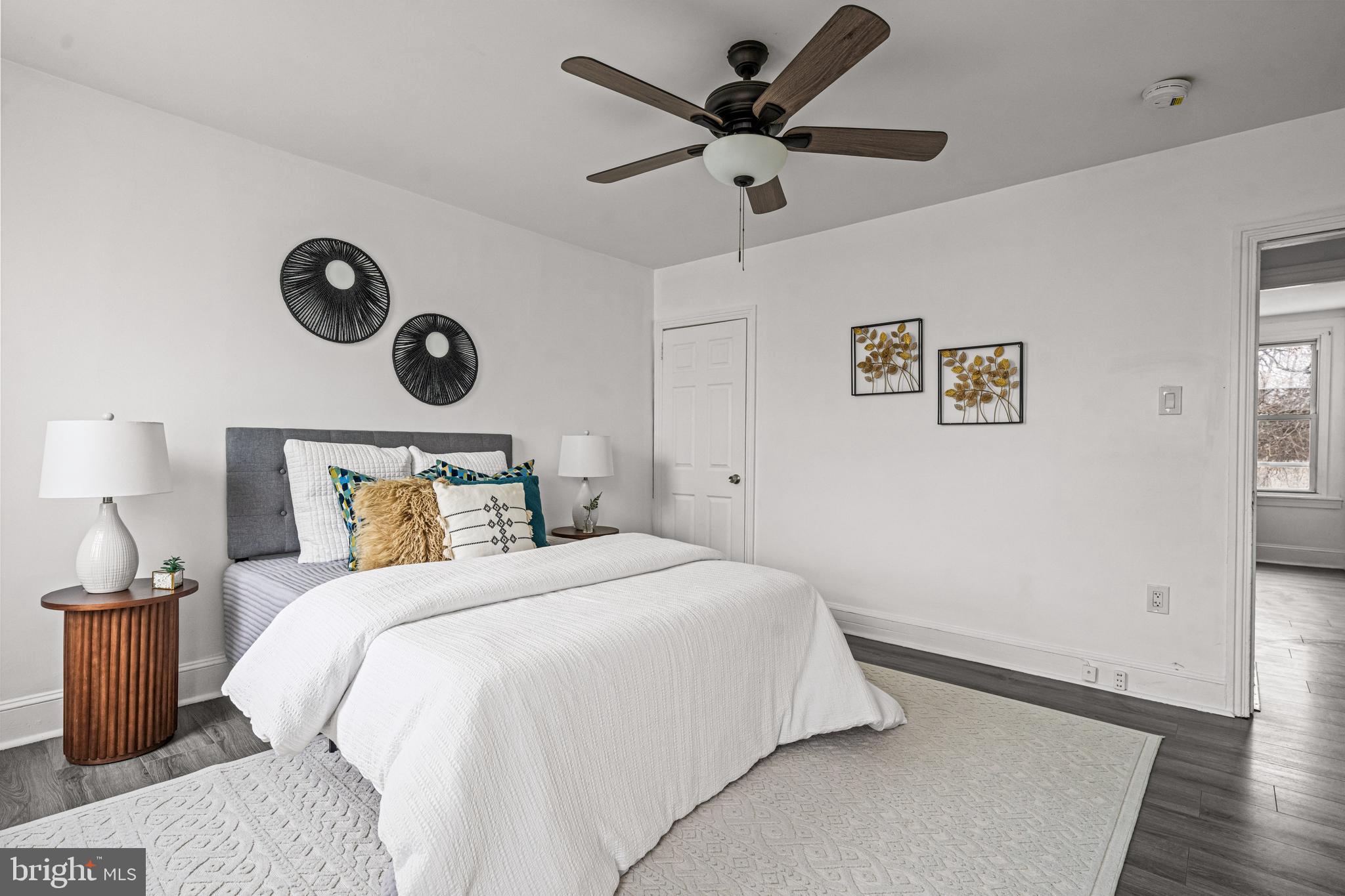 239 3rd Street Gloucester City, NJ 08030 - Photo 15 of 20 a bedroom with a bed and a lamp on the dresser