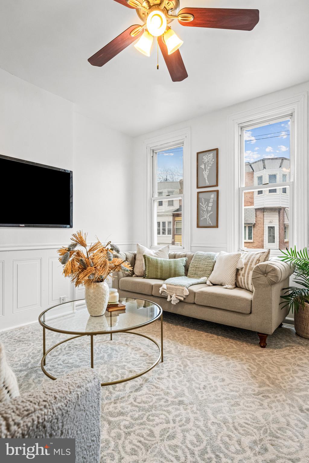 239 3rd Street Gloucester City, NJ 08030 - Photo 4 of 20 a living room with furniture and a flat screen tv