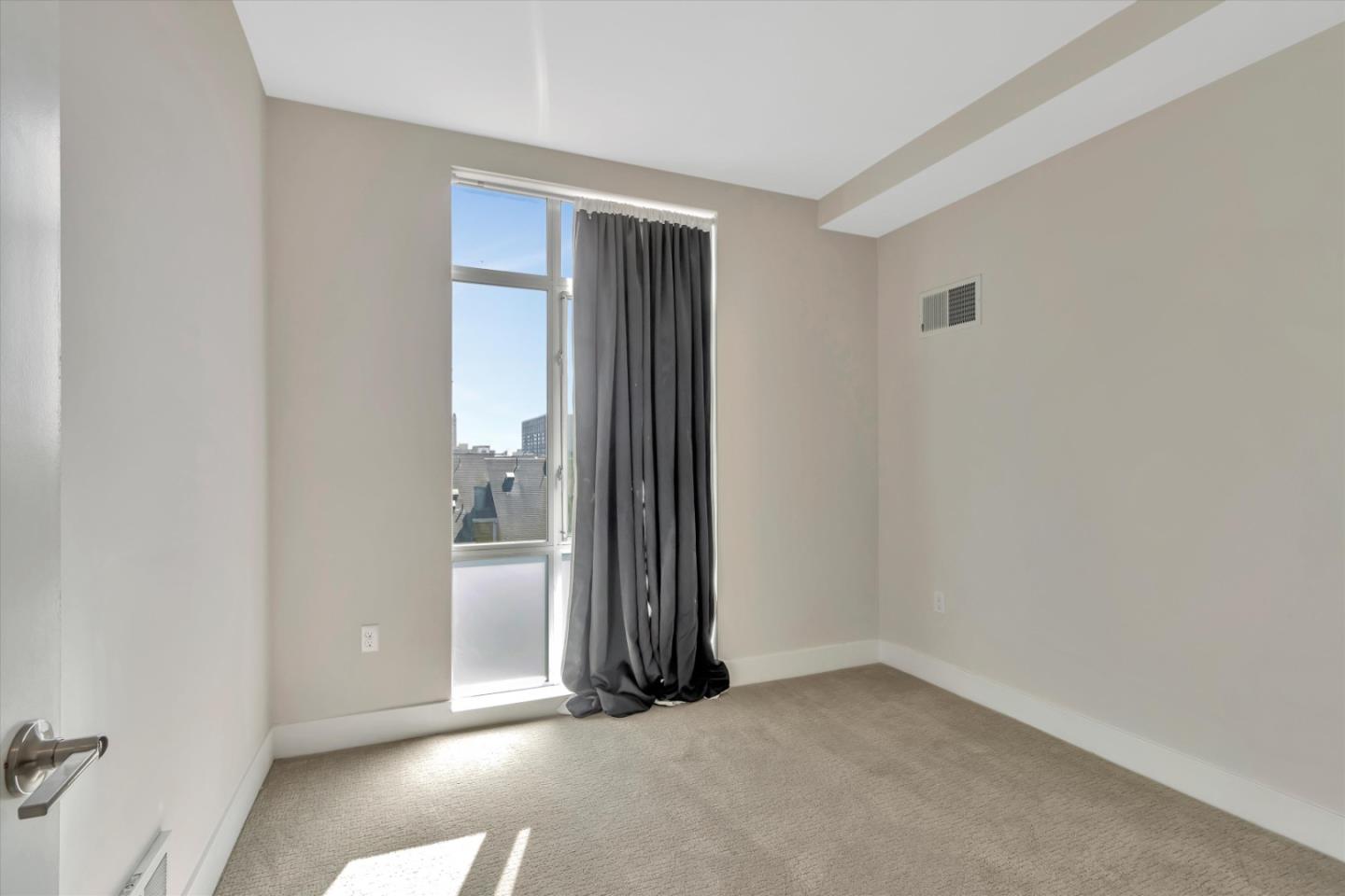 901 Jefferson Street, Unit 510 Oakland, CA 94607 - Photo 11 of 15 an empty room with closet