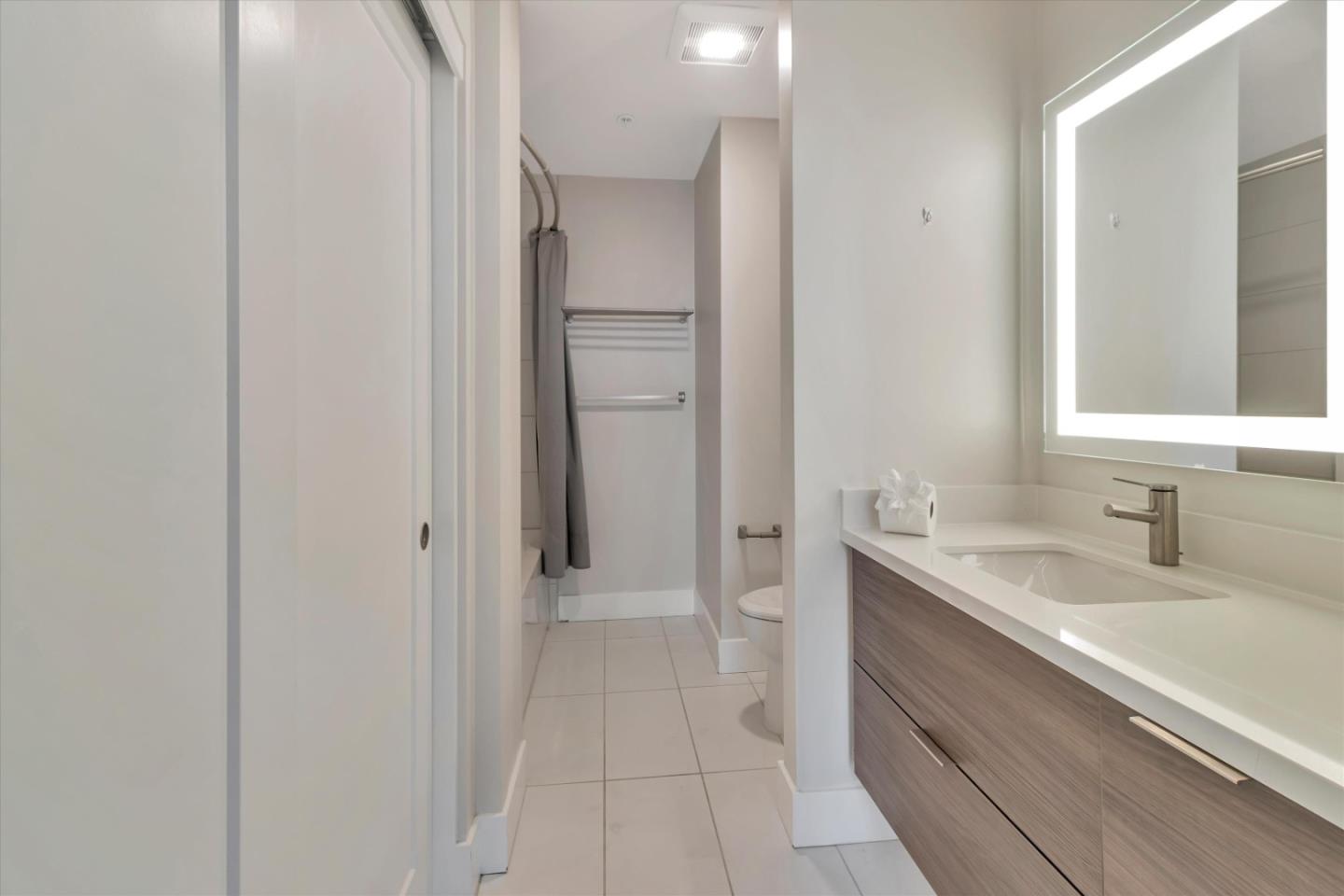 901 Jefferson Street, Unit 510 Oakland, CA 94607 - Photo 12 of 15 a bathroom with a sink and a mirror