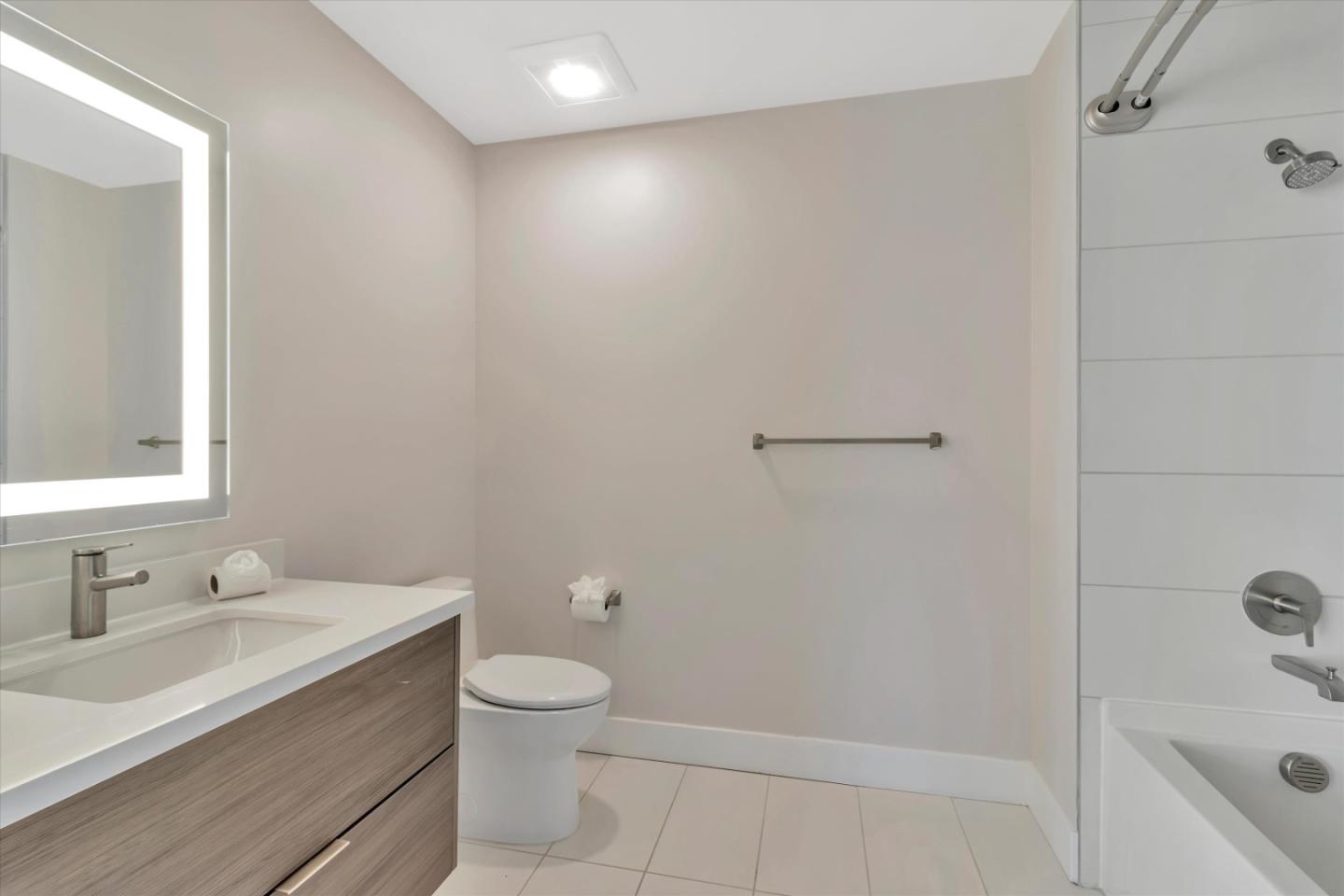 901 Jefferson Street, Unit 510 Oakland, CA 94607 - Photo 13 of 15 a bathroom with a sink a toilet and shower