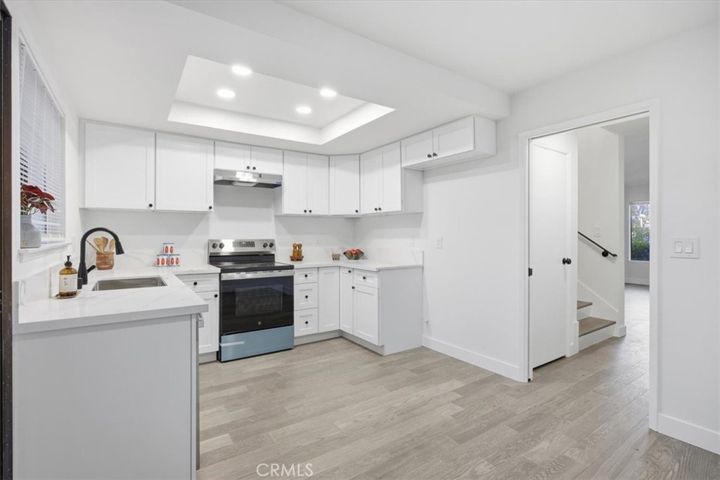 28192 Ridgecove Court South Rancho Palos Verdes, CA 90275 - Photo 1 of 1 a kitchen with white cabinets and white appliances