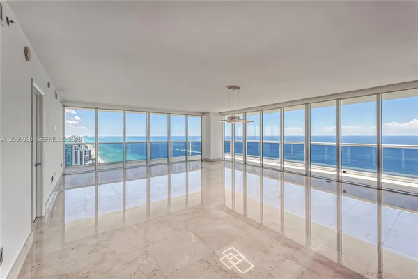 a view of a big room with windows