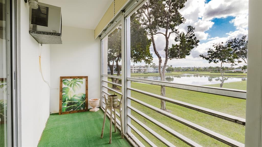 272 Preston Way, Unit 272 Boca Raton, FL 33434 - Photo 16 of 20 a view of outdoor space with deck and living room