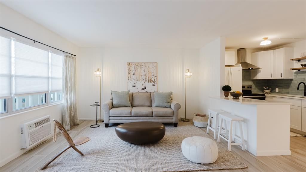 272 Preston Way, Unit 272 Boca Raton, FL 33434 - Photo 3 of 20 a living room with furniture and a large window
