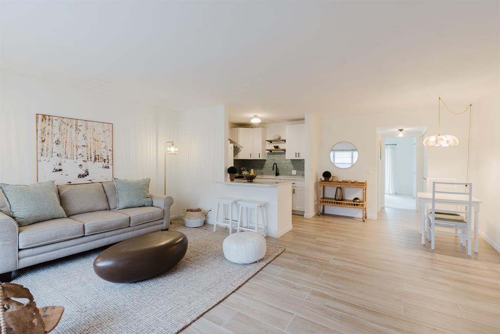 272 Preston Way, Unit 272 Boca Raton, FL 33434 - Photo 6 of 20 a living room with furniture and a wooden floor