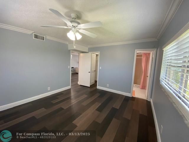 8990 South Hollybrook Boulevard, Unit 301 Pembroke Pines, FL 33025 - Photo 15 of 52 wooden floor in an empty room with a window