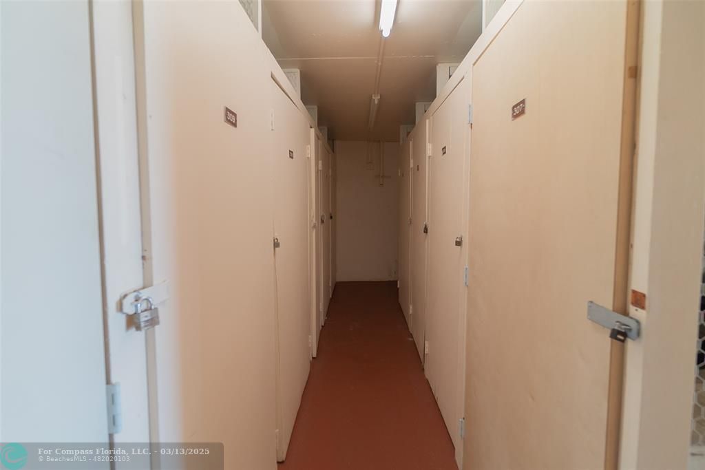 8990 South Hollybrook Boulevard, Unit 301 Pembroke Pines, FL 33025 - Photo 20 of 52 a view of a hallway with a wooden floor