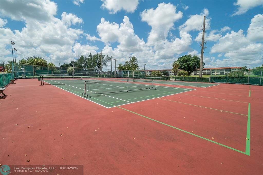 8990 South Hollybrook Boulevard, Unit 301 Pembroke Pines, FL 33025 - Photo 32 of 52 a view of a tennis court
