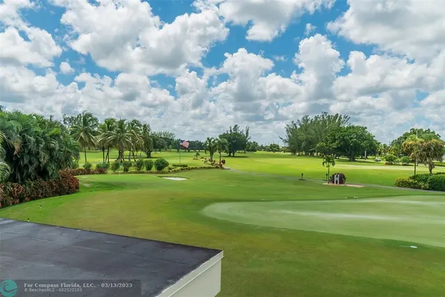 a view of a golf course with a fountain