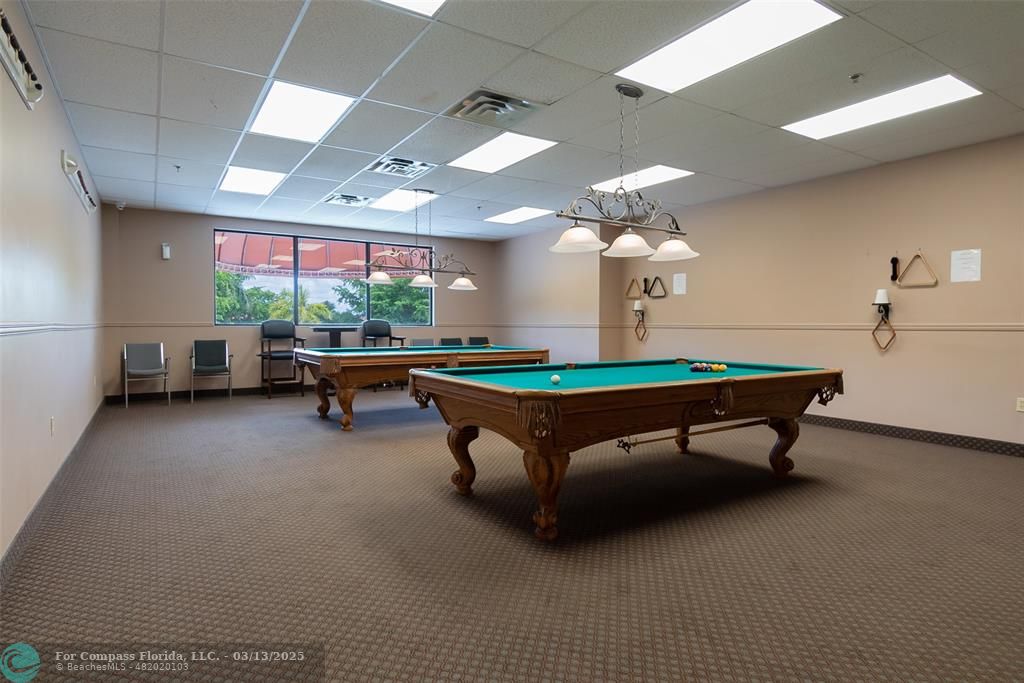 8990 South Hollybrook Boulevard, Unit 301 Pembroke Pines, FL 33025 - Photo 42 of 52 a room with pool table and windows