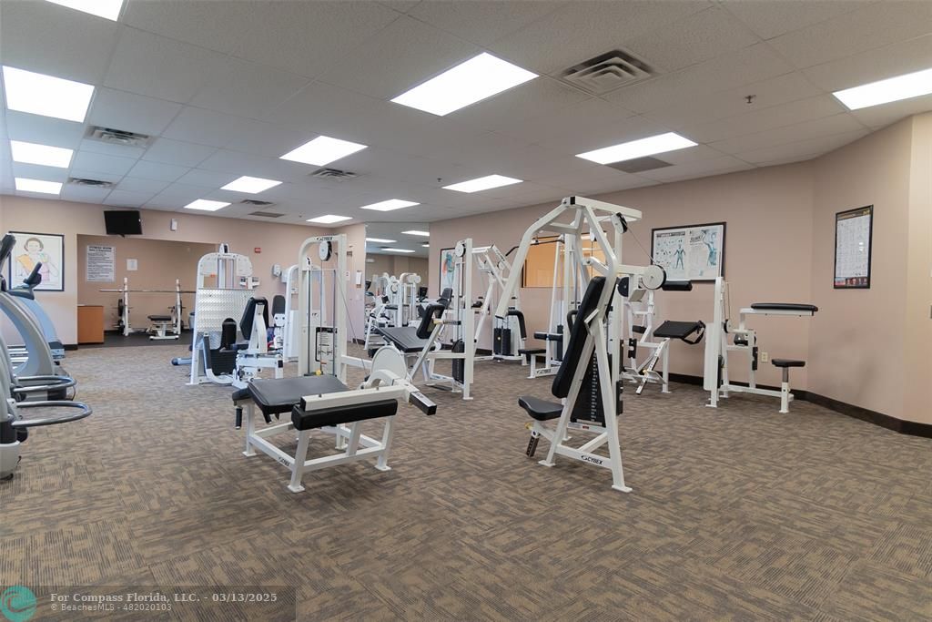 8990 South Hollybrook Boulevard, Unit 301 Pembroke Pines, FL 33025 - Photo 43 of 52 a view of a room with gym equipment