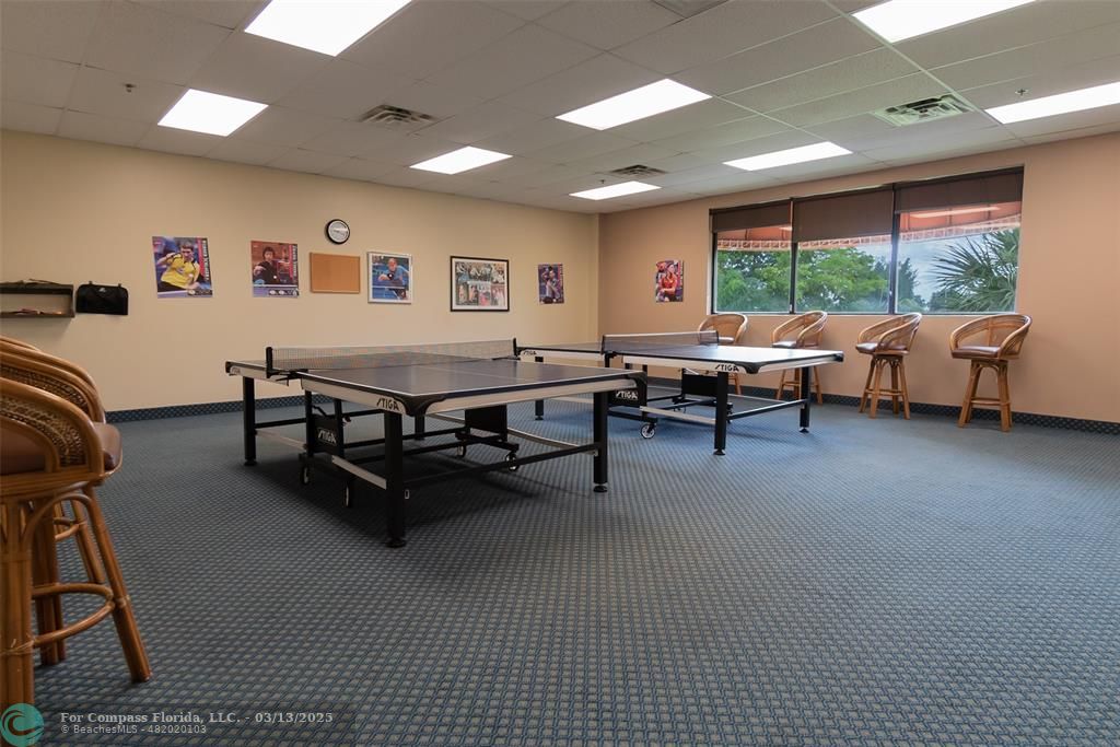 8990 South Hollybrook Boulevard, Unit 301 Pembroke Pines, FL 33025 - Photo 45 of 52 a living room with furniture pool table and a large window