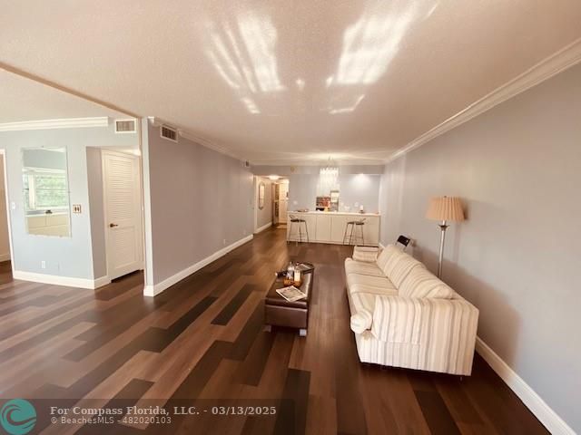 8990 South Hollybrook Boulevard, Unit 301 Pembroke Pines, FL 33025 - Photo 6 of 52 a living room with furniture and a wooden floor