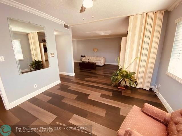 8990 South Hollybrook Boulevard, Unit 301 Pembroke Pines, FL 33025 - Photo 7 of 52 a living room with furniture and a large window