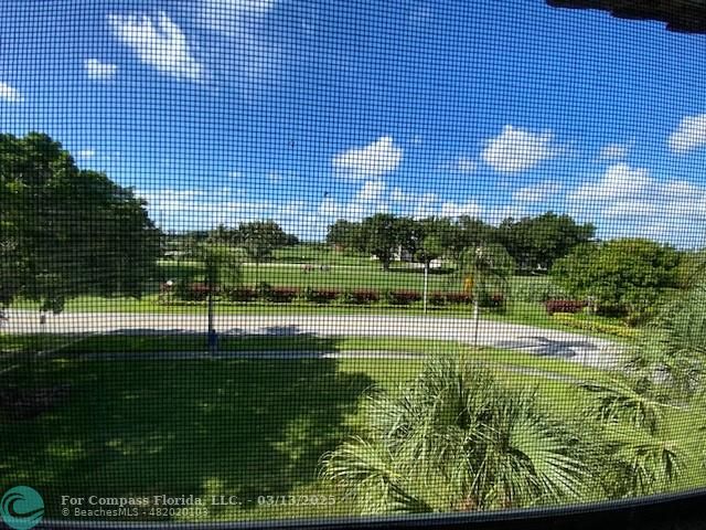 8990 South Hollybrook Boulevard, Unit 301 Pembroke Pines, FL 33025 - Photo 8 of 52 a view of building with garden