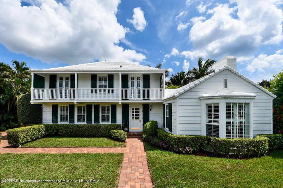 223 Orange Grove Road Palm Beach, FL 33480 - Photo 1 of 12 a front view of a house with a yard