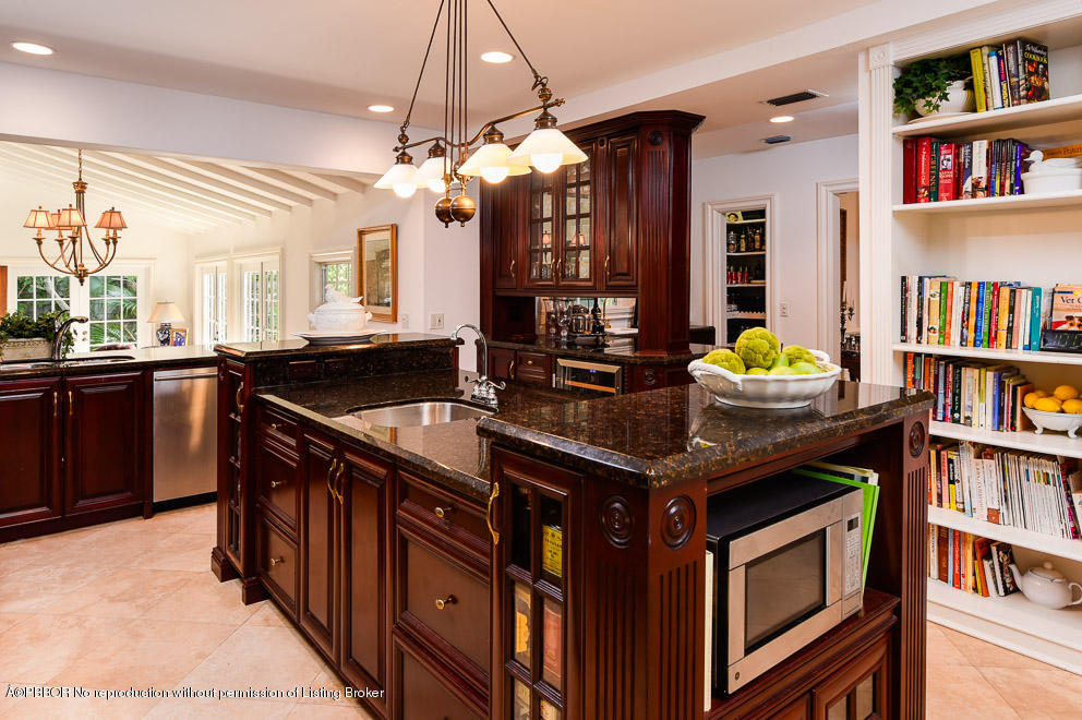 223 Orange Grove Road Palm Beach, FL 33480 - Photo 6 of 12 a kitchen that has a lot of cabinets