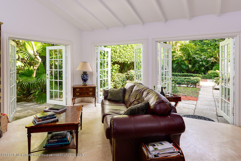 223 Orange Grove Road Palm Beach, FL 33480 - Photo 7 of 12 a living room with furniture and a large window