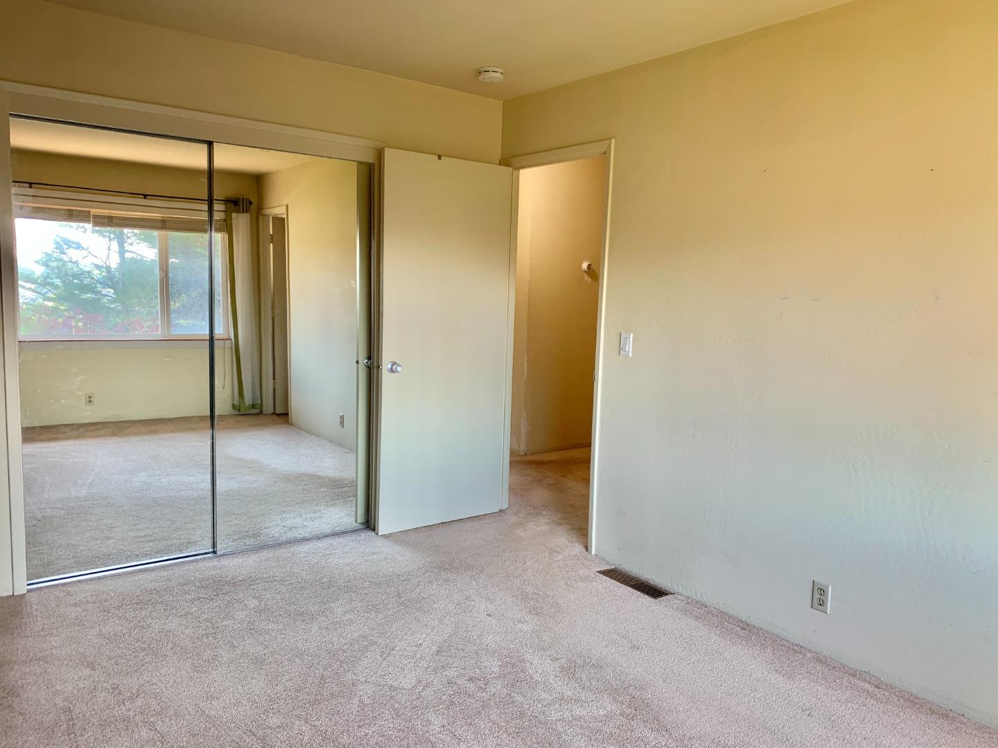 1291 Park Pacifica Avenue Pacifica, CA 94044 - Photo 12 of 18 an empty room with a glass door and shower
