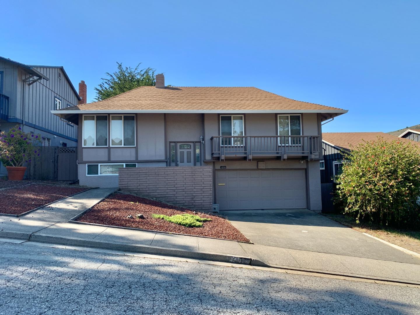1291 Park Pacifica Avenue Pacifica, CA 94044 - Photo 2 of 18 a front view of a house with yard