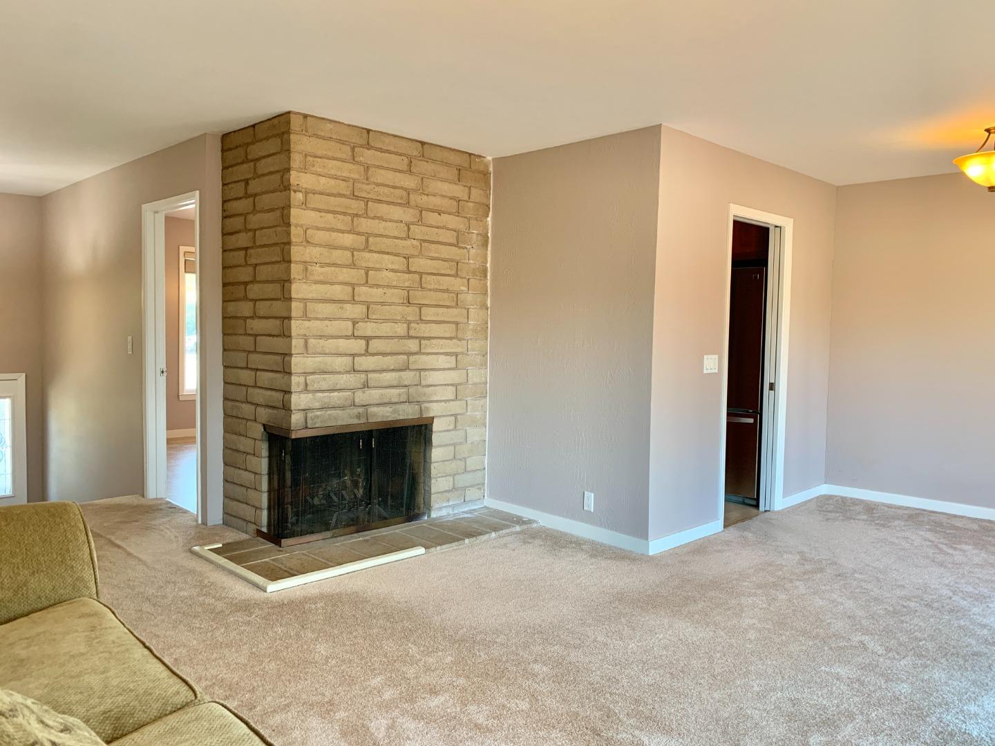 1291 Park Pacifica Avenue Pacifica, CA 94044 - Photo 6 of 18 a view of an empty room with a fireplace