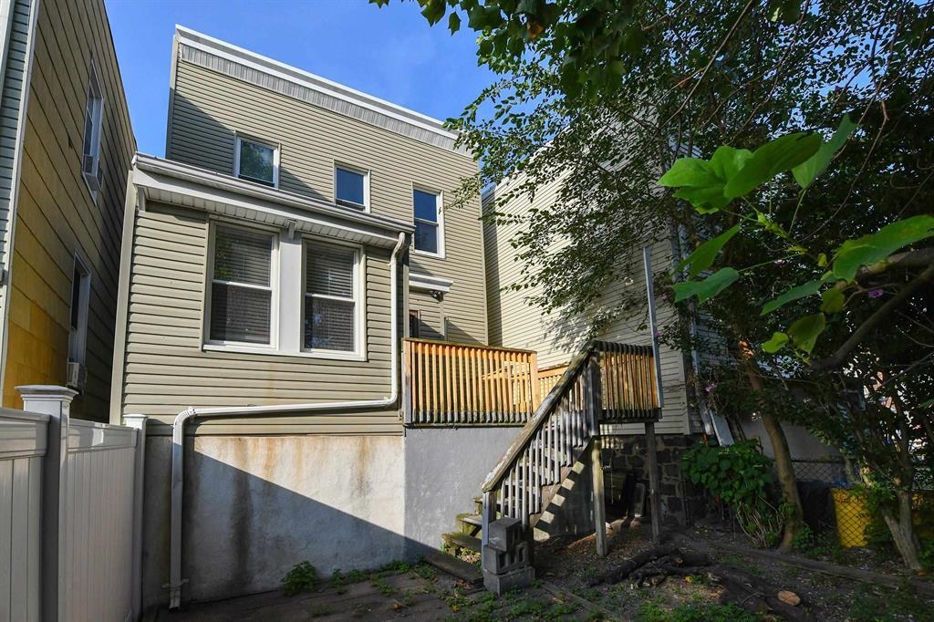 426 Hancock Place Fairview, NJ 07022 - Photo 14 of 14 a front view of a house with garage and deck