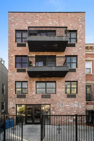 a front view of a building with glass windows