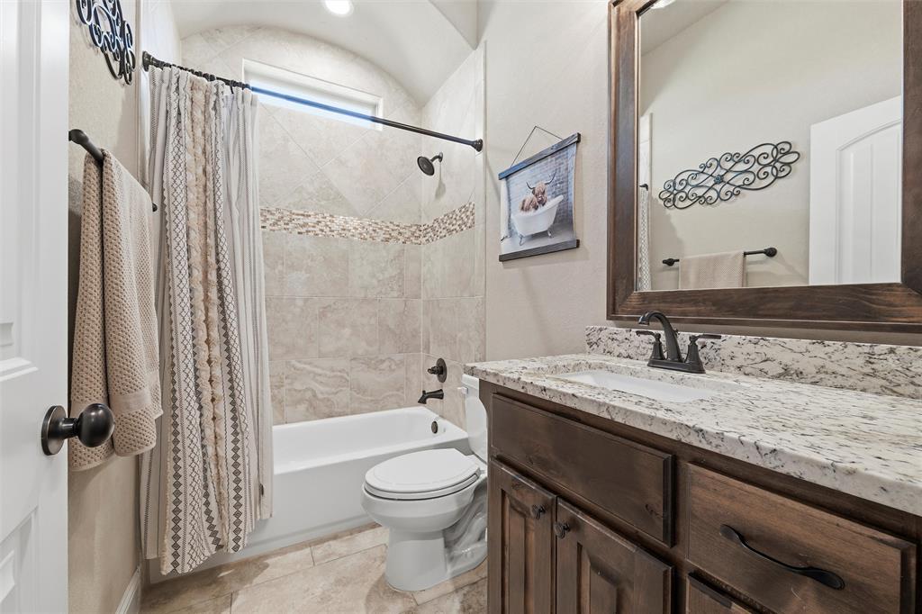 121 Bluff Ridge Court Paradise, TX 76073 - Photo 22 of 33 Full bath featuring shower / bath combination with curtain and vanity