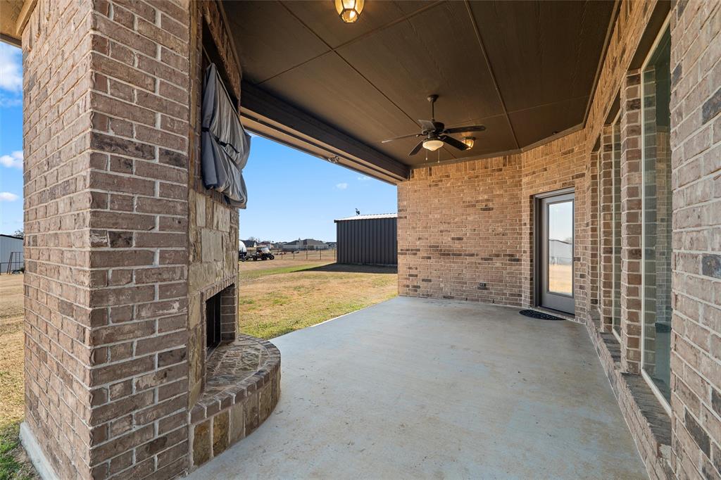 121 Bluff Ridge Court Paradise, TX 76073 - Photo 25 of 33 View of patio / terrace featuring a ceiling fan