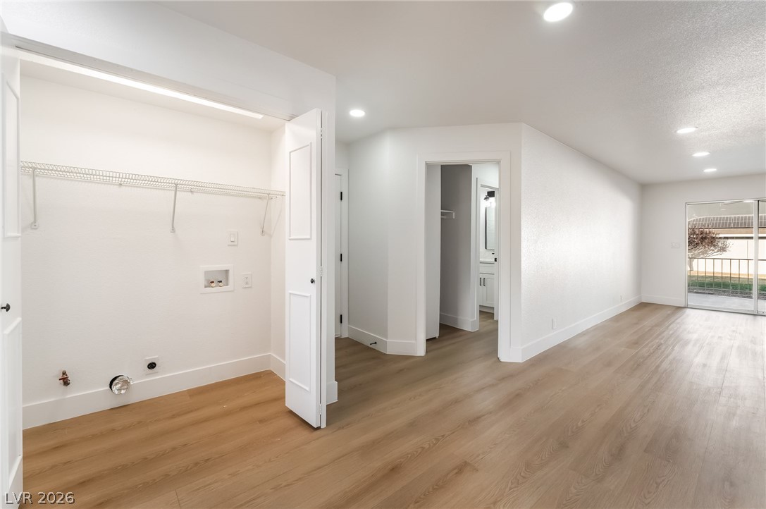 429 Crestway Road Henderson, NV 89015 - Photo 41 of 56 A dedicated laundry closet offers convenient hookups, complementing the wood flooring throughout this open space.