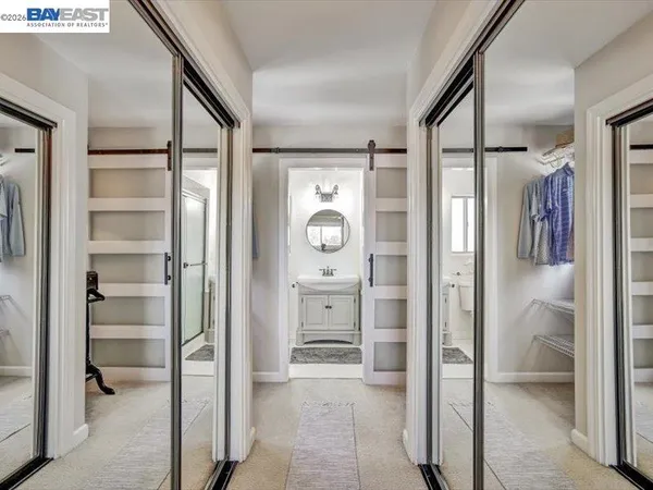 a bathroom with a shower and a glass door