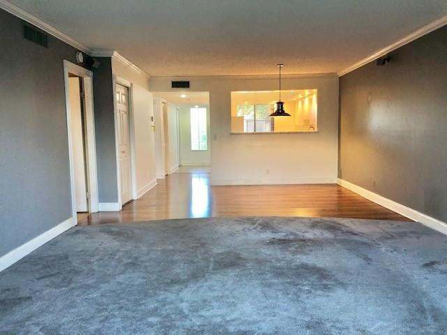 310 Racquet Club Road, Unit 203 Weston, FL 33326 - Photo 6 of 14 en view interior of a house with a empty space and windows