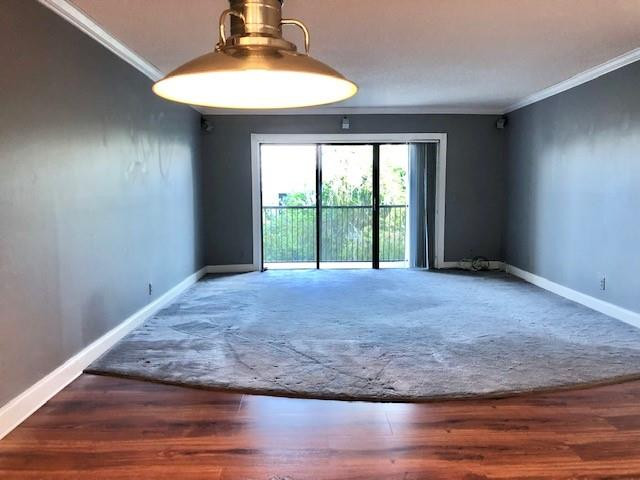 310 Racquet Club Road, Unit 203 Weston, FL 33326 - Photo 8 of 14 a view of empty room with wooden floor