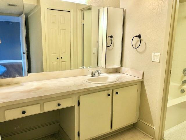 310 Racquet Club Road, Unit 203 Weston, FL 33326 - Photo 10 of 14 a bathroom with a granite countertop sink and a mirror