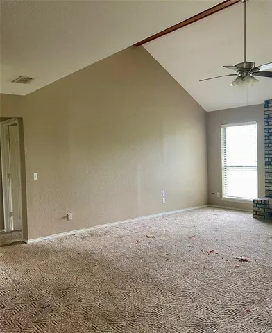 a view of an empty room with a window